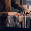 someone looking through records (albums)